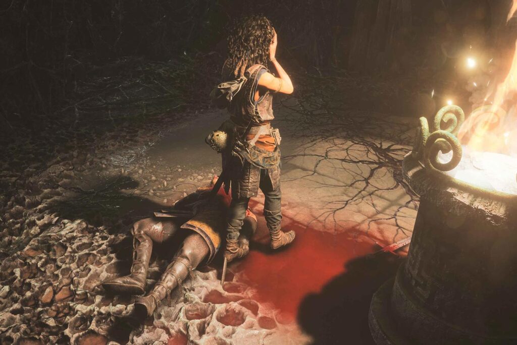 Sophia di spalle, protagonista di Resonance: A Plague Tale Legacy, con un nemico sconfitto a terra in una pozza di sangue