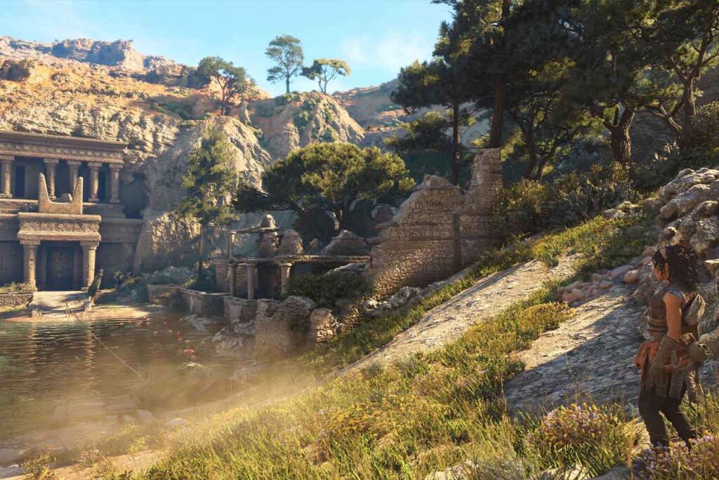 Un tempio incastonato nella roccia di una montagna, con un laghetto e dei fenicotteri davanti all'entrata, uno dei bellissimi panorami di Resonance: A Plague Tale Legacy