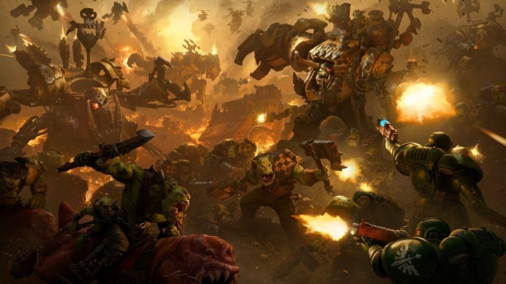 Un mech degli Ork spara tra esplosioni e fiamme in una caotica battaglia di Warhammer 40,000: Dawn of War IV